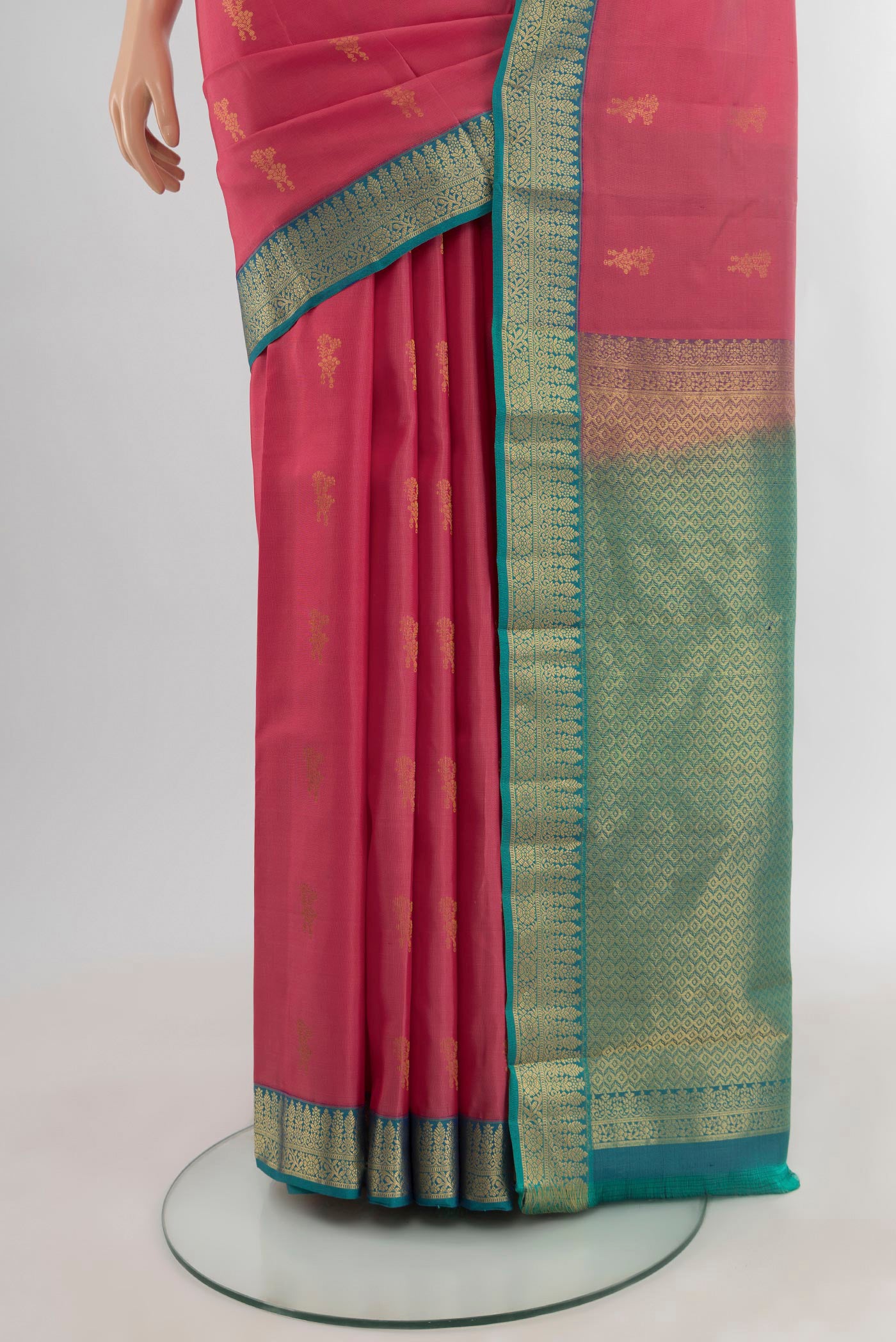 Pleats and pallu of Pink Kanchipuram Silk Saree with Zari Butta on the body and Zari Border. 