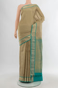 Grey Kanchipuram Silk Saree with Zari Butta on the body and Zari Border.  displayed on a mannequin