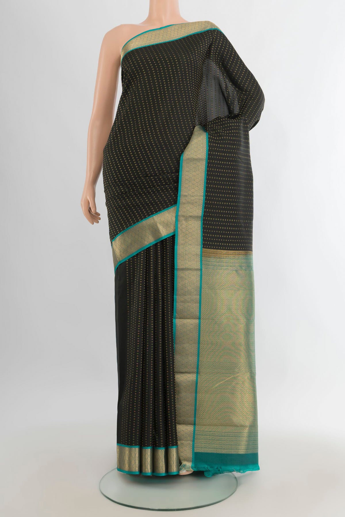 Pure Silk Black Kanchipuram Saree with Zari Butta on the body and Zari Border.  displayed on a mannequin