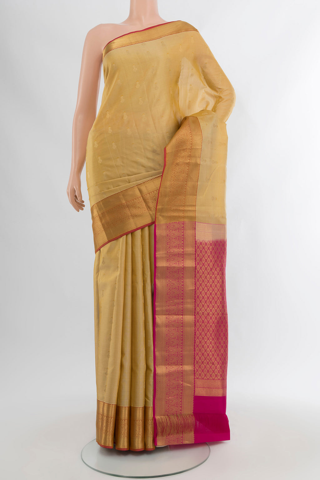 Sandal Kanjivaram Silk Saree with Zari Butta on the body and Silk Border.  displayed on a mannequin