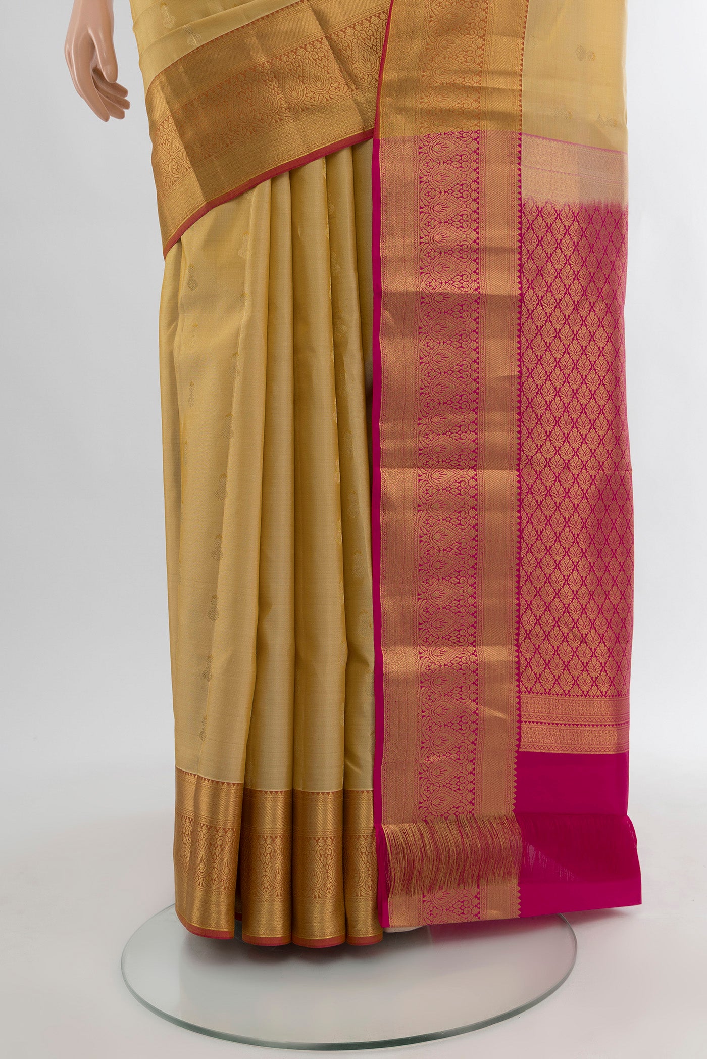 Pleats and pallu of Sandal Kanjivaram Silk Saree with Zari Butta on the body and Silk Border. 
