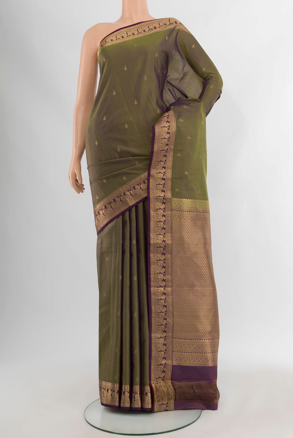 Mehandi Green Kanjivaram Silk Saree with Zari Butta on the body and Zari Border.  displayed on a mannequin