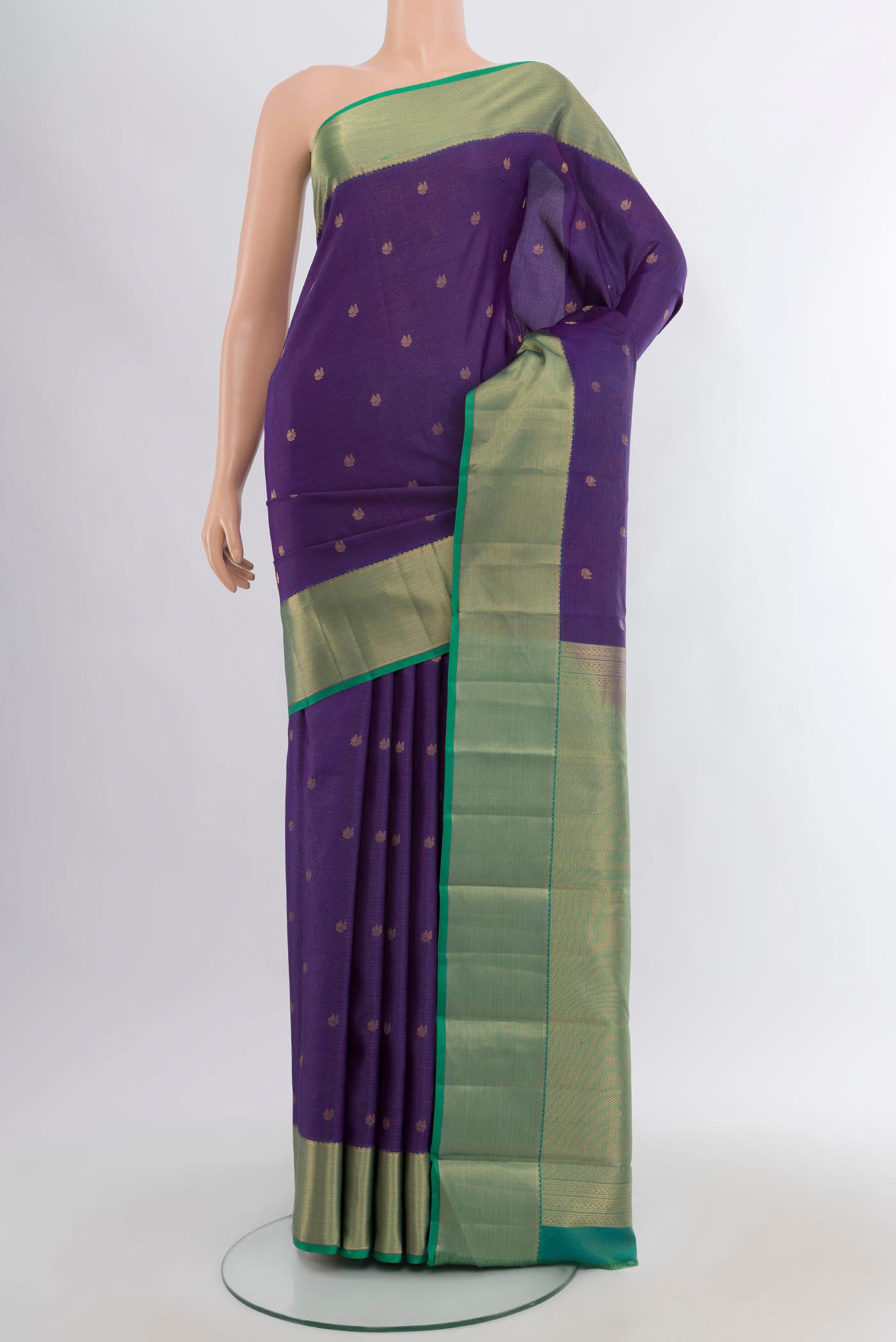 Violet Kanjivaram Silk Saree with Zari Butta on the body and Zari Border.  displayed on a mannequin