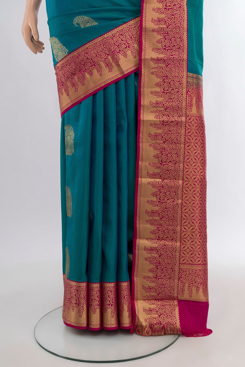 Pleats and pallu of Peacock Blue Kanjivaram Silk Saree with Zari Butta on the body and Zari Border. 