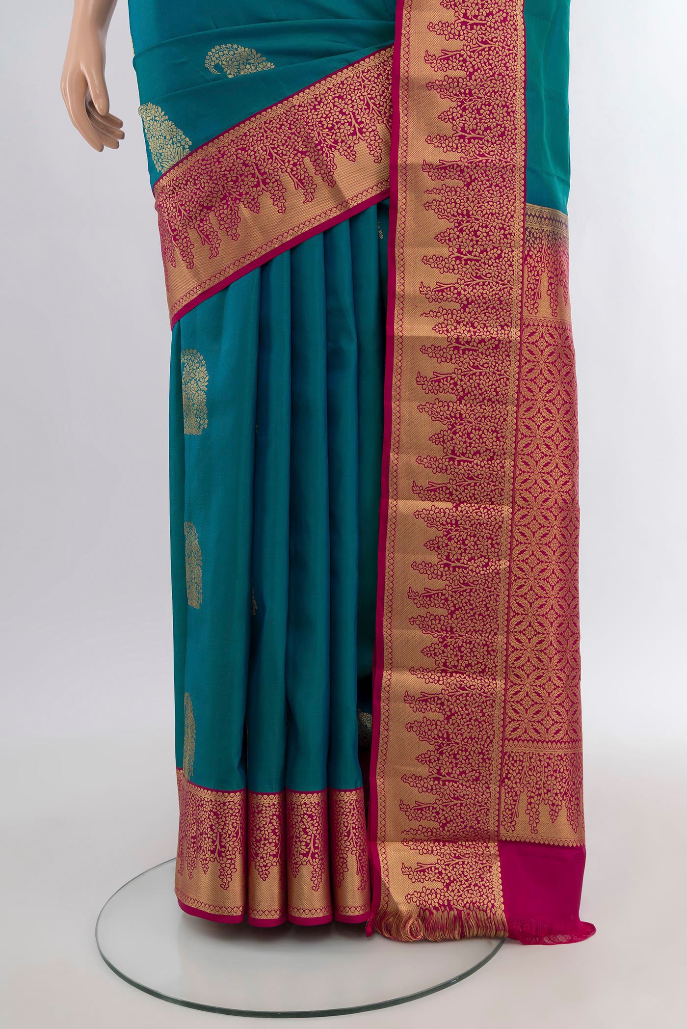 Pleats and pallu of Peacock Blue Kanjivaram Silk Saree with Zari Butta on the body and Zari Border. 