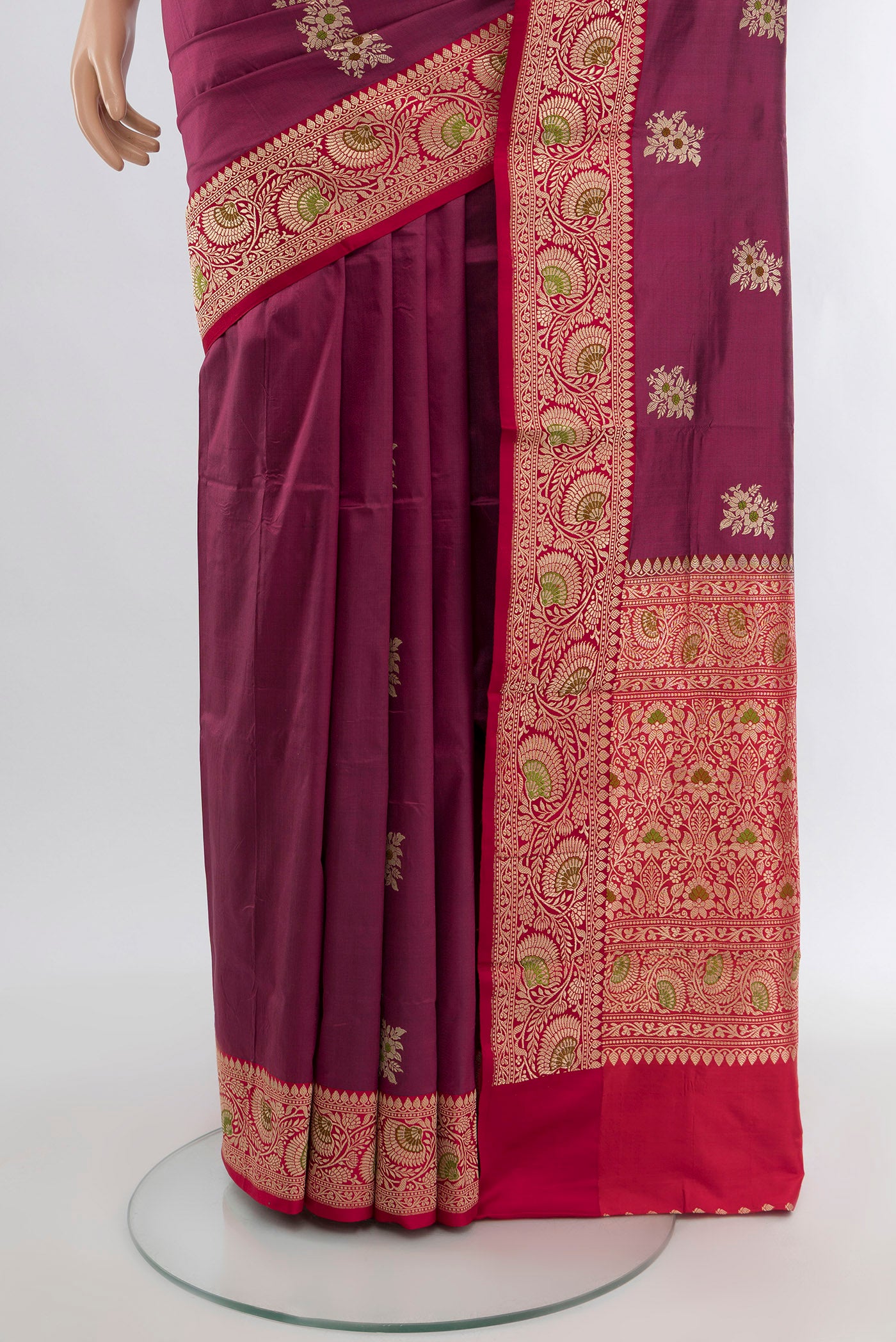 Pleats and pallu of Maroon Banarasi Katan Silk Saree with Zari Butta on the body and Zari Border. 
