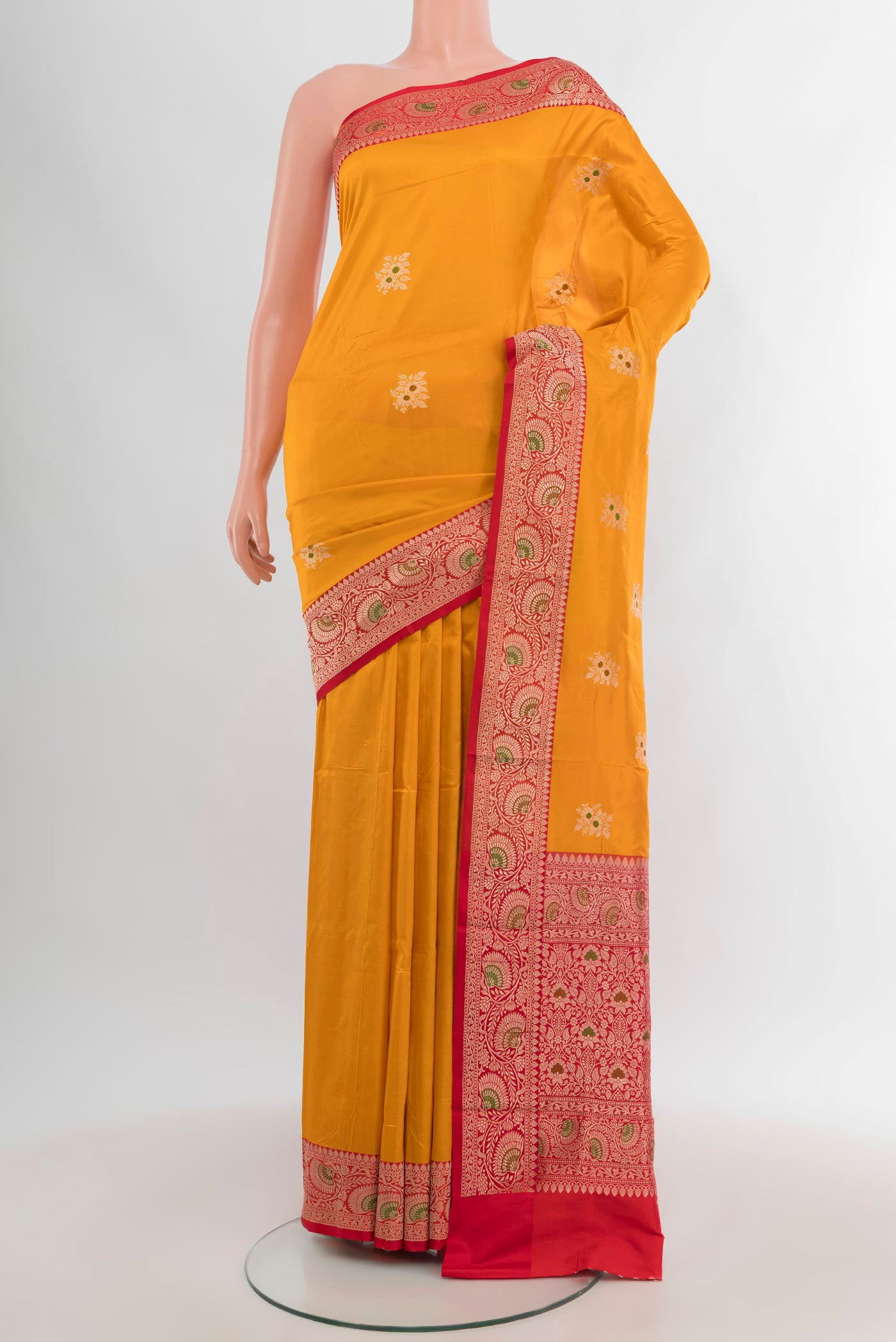 Yellow Banarasi Katan Silk Saree with Zari Butta on the body and Zari Border.  displayed on a mannequin