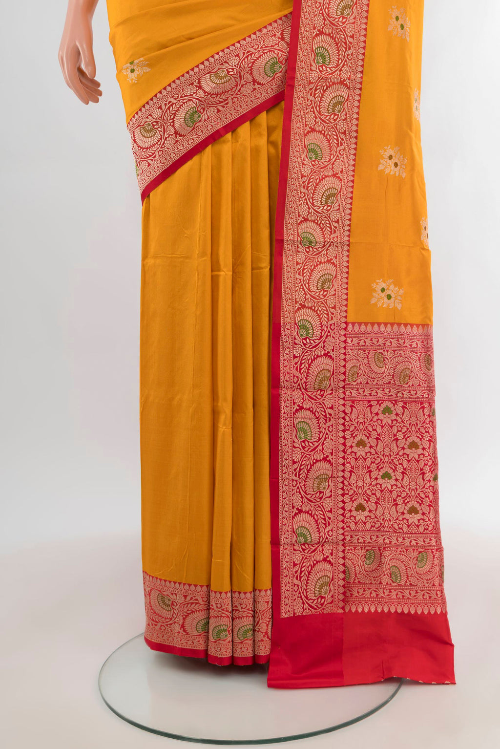 Pleats and pallu of Yellow Banarasi Katan Silk Saree with Zari Butta on the body and Zari Border. 