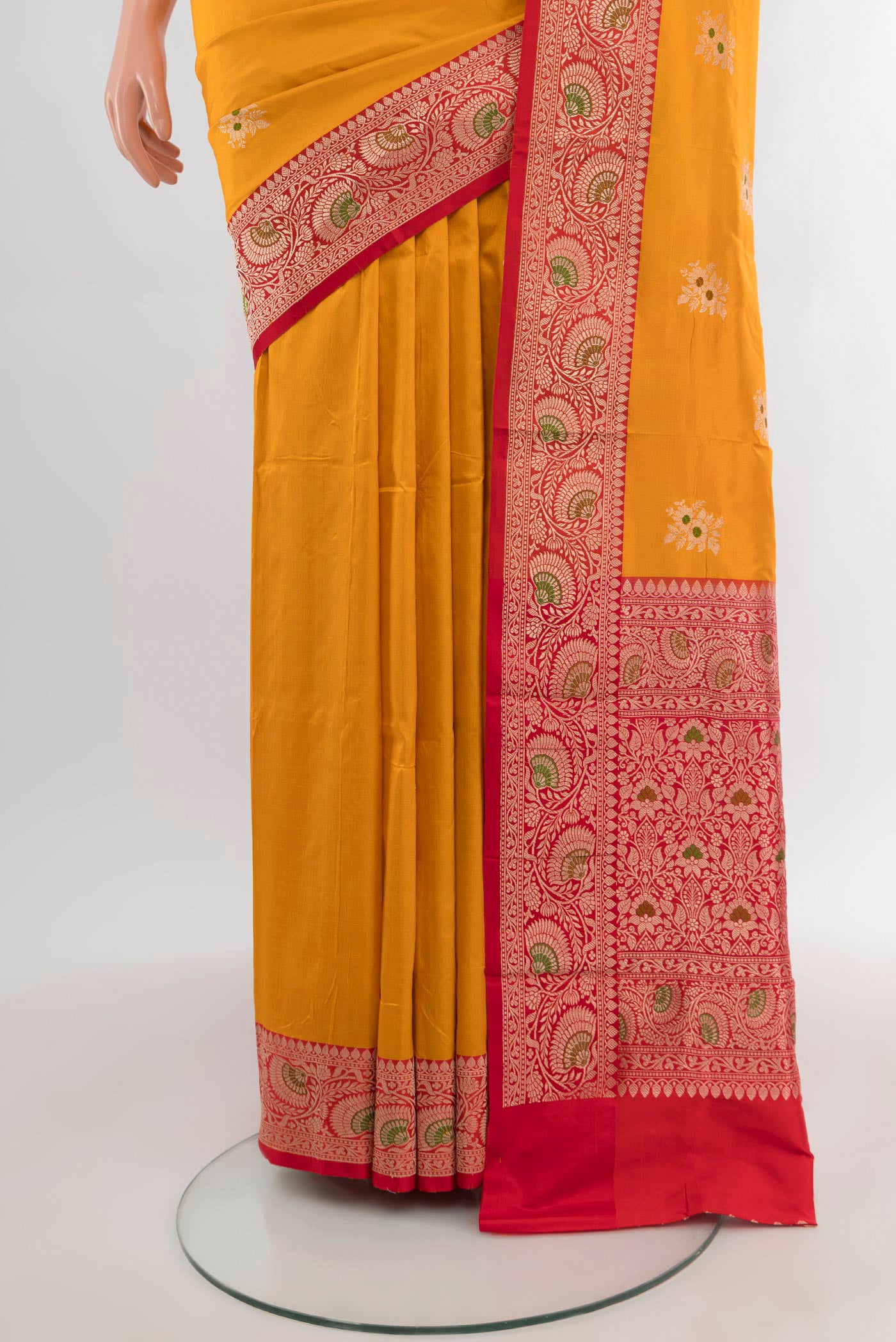 Pleats and pallu of Yellow Banarasi Katan Silk Saree with Zari Butta on the body and Zari Border. 