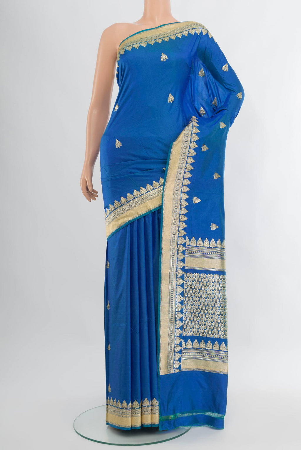 Royal Blue Banarasi Katan Silk Saree with Zari Butta on the body and Fancy Border.  displayed on a mannequin