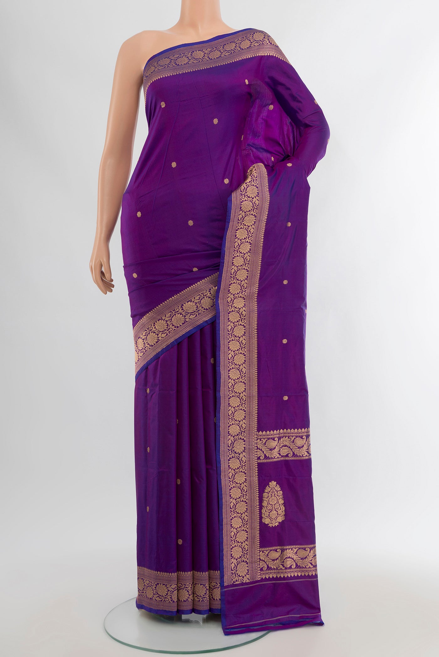 Violet Banarasi Katan Silk Saree with Zari Butta on the body and Zari Border.  displayed on a mannequin