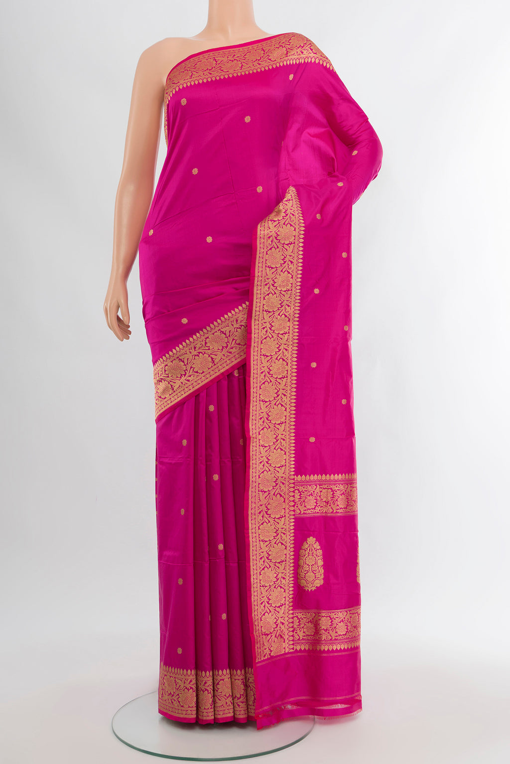 Magenta Banarasi Katan Silk Saree with Zari Butta on the body and Zari Border.  displayed on a mannequin
