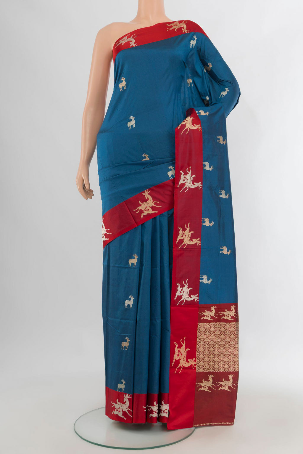 Pure Silk Blue Banarasi Katan Saree with Zari Butta on the body and Plain Border.  displayed on a mannequin