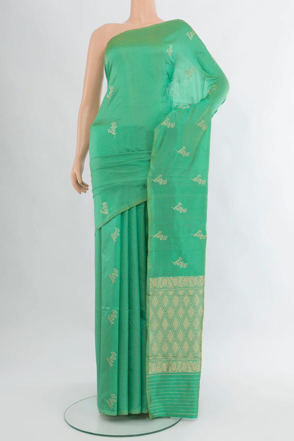Sea Green Banarasi Katan Silk Saree with Zari Butta on the body and Without Border.  displayed on a mannequin