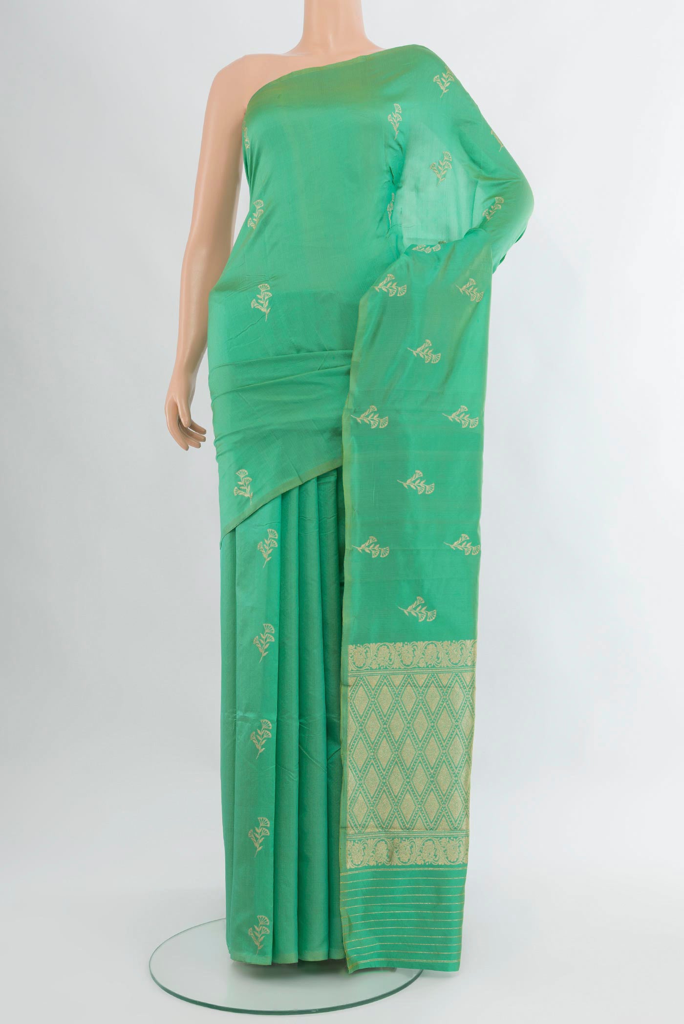Sea Green Banarasi Katan Silk Saree with Zari Butta on the body and Without Border.  displayed on a mannequin