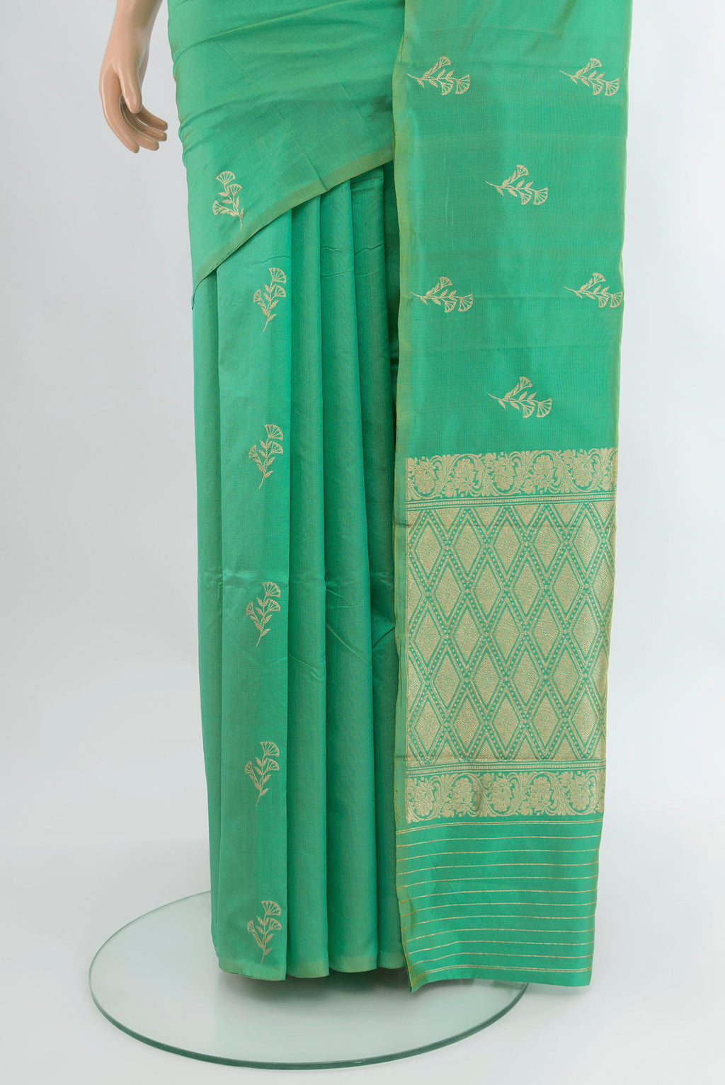 Pleats and pallu of Sea Green Banarasi Katan Silk Saree with Zari Butta on the body and Without Border. 