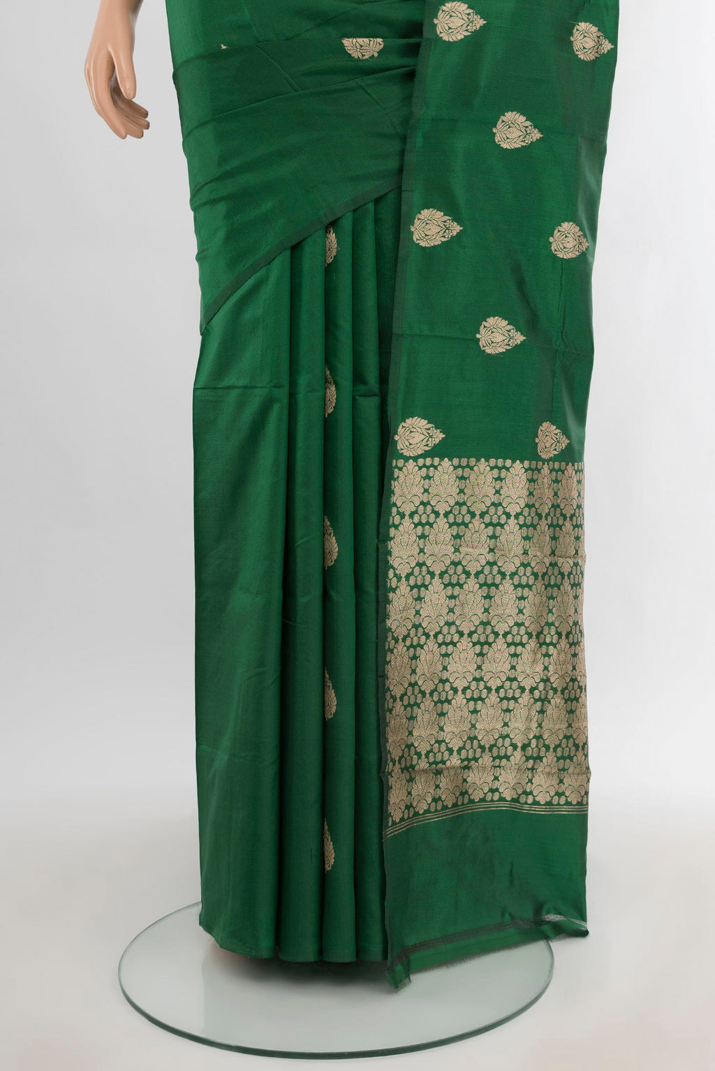 Pleats and pallu of Bottle Green Banarasi Katan Silk Saree with Zari Butta on the body and Without Border. 
