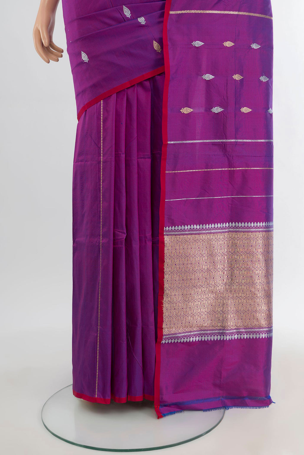 Pleats and pallu of Purple Banarasi Katan Silk Saree with Zari Butta on the body and Without Border. 