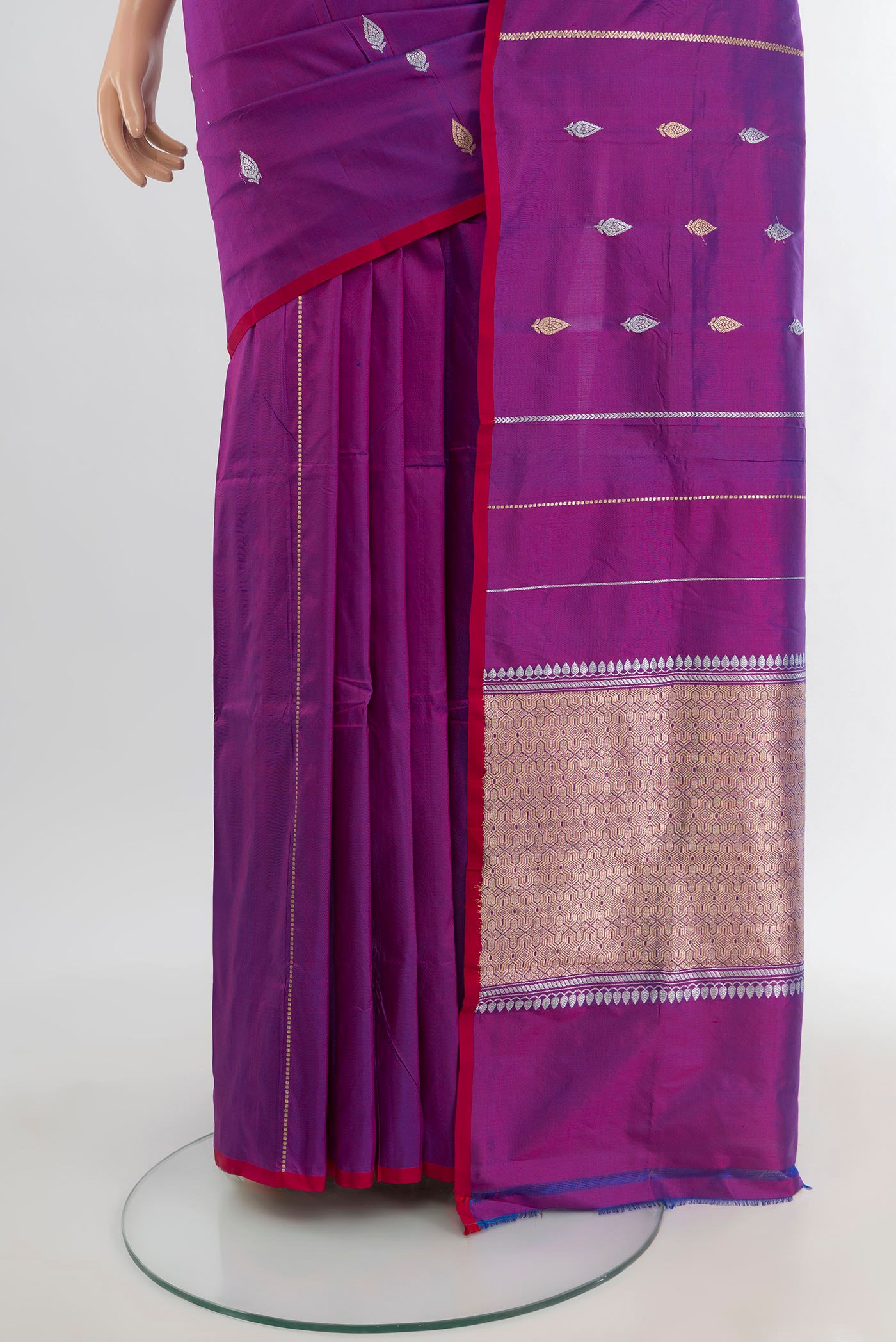 Pleats and pallu of Purple Banarasi Katan Silk Saree with Zari Butta on the body and Without Border. 