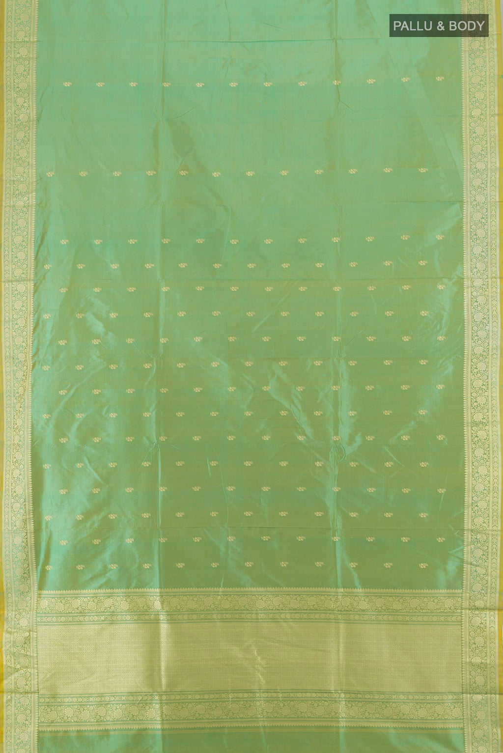 Flat view of Light Green Banarasi Katan Silk Saree with Zari Butta on the body and Zari Border. 