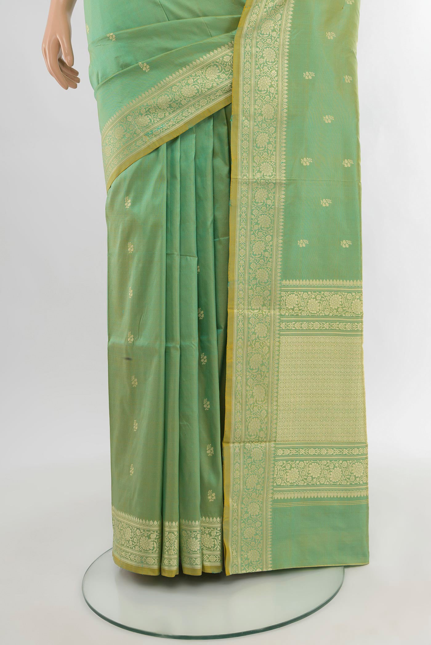 Pleats and pallu of Light Green Banarasi Katan Silk Saree with Zari Butta on the body and Zari Border. 
