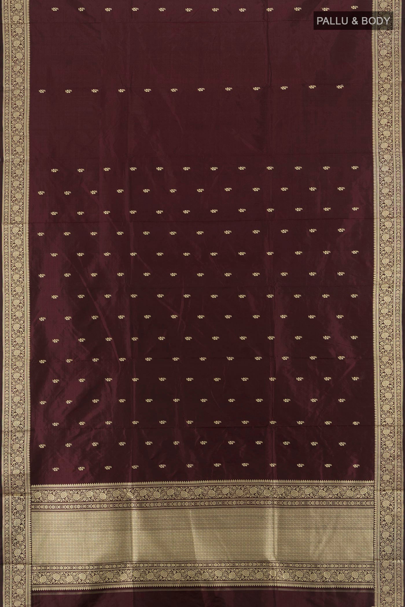 Flat view of Coffee Brown Banarasi Katan Silk Saree with Thread Butta on the body and Thread Border. 