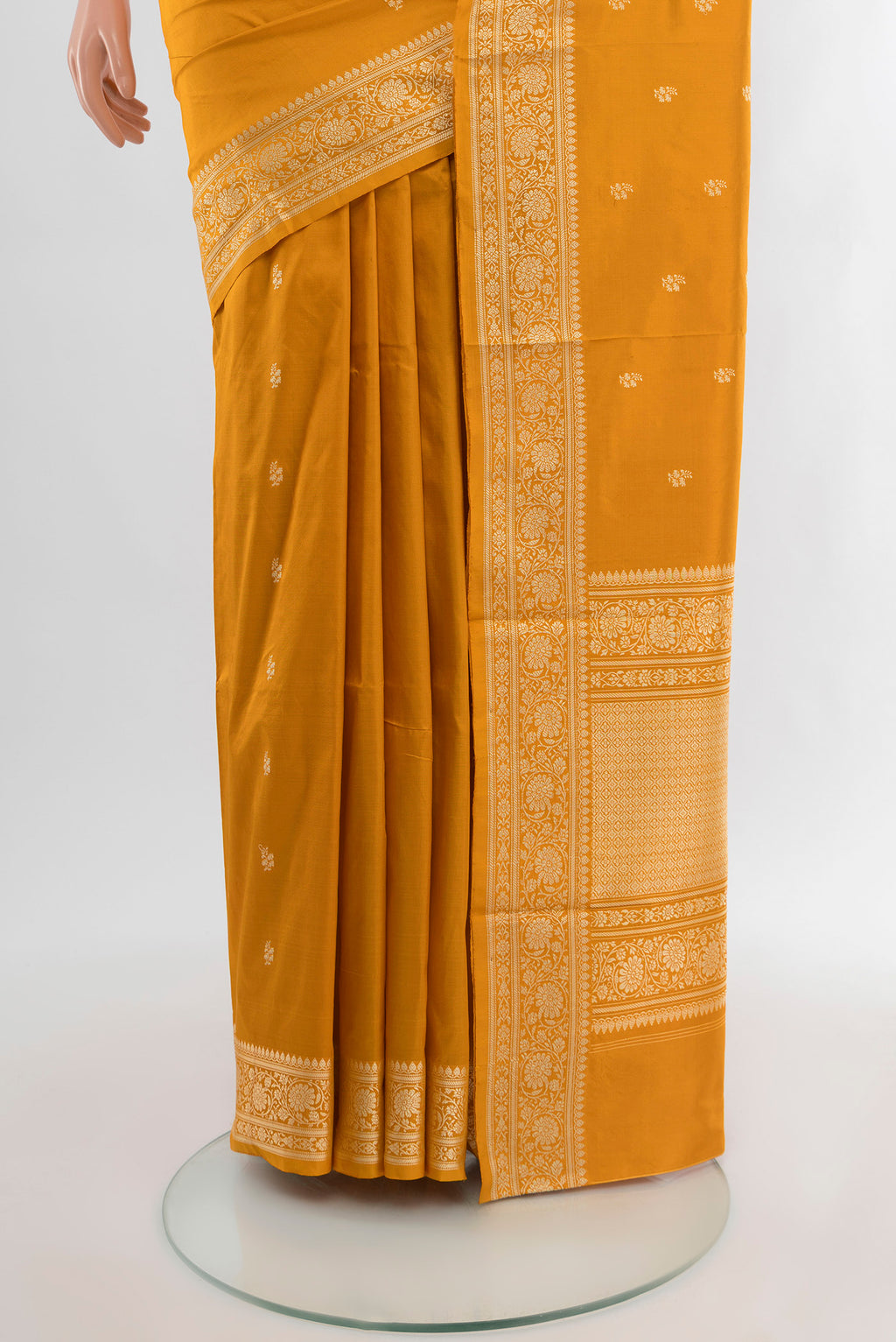 Pleats and pallu of Yellow Banarasi Katan Silk Saree with Zari Butta on the body and Silk Border. 