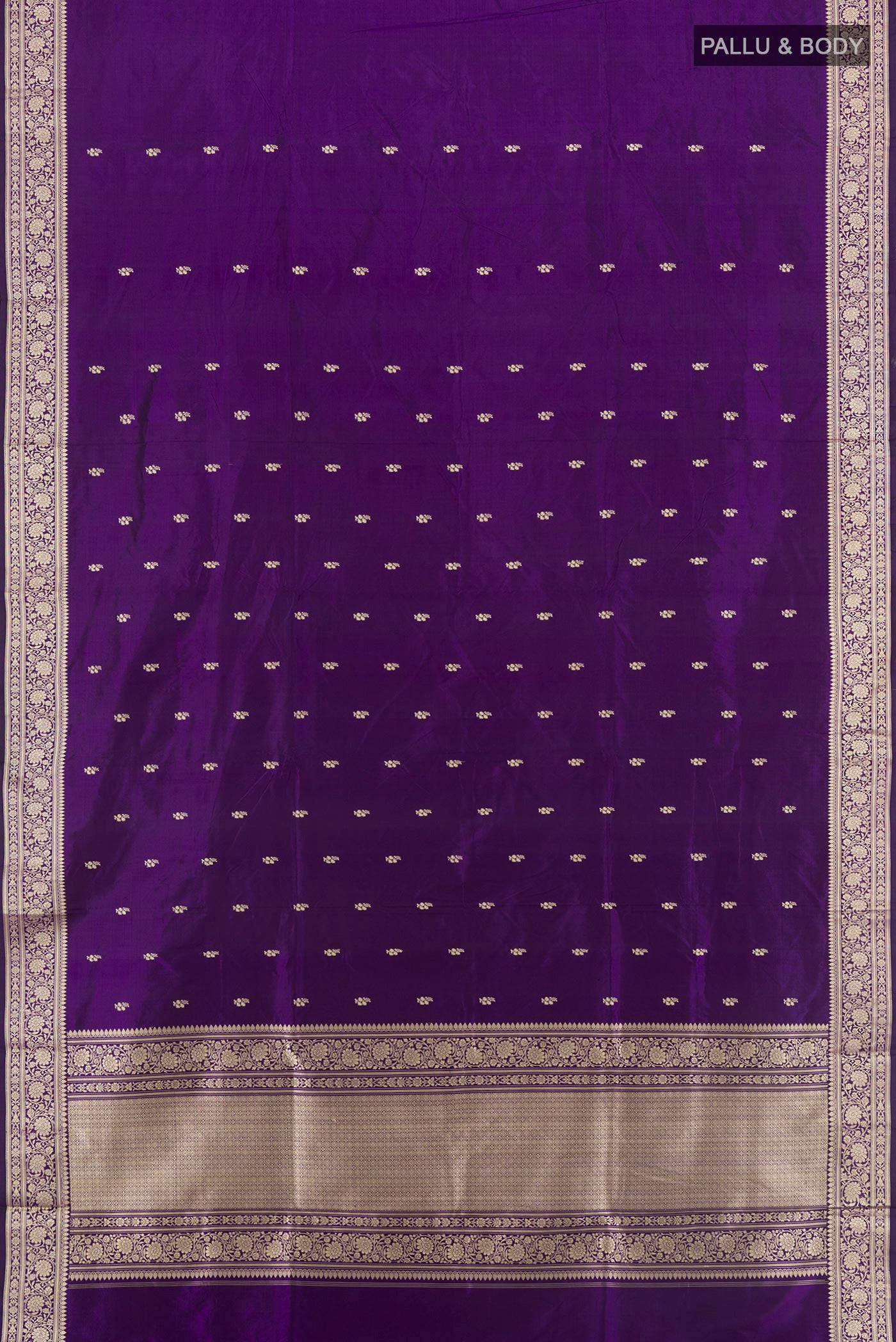 Flat view of Violet Banarasi Katan Silk Saree with Thread Butta on the body and Thread Border. 