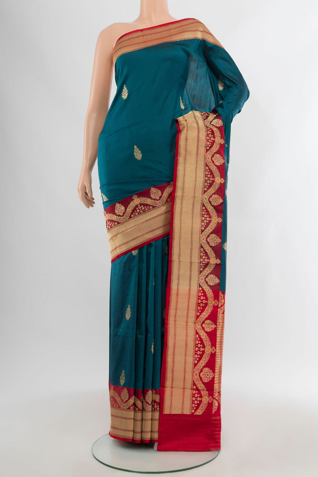 Blue Banarasi Katan Silk Saree with Zari Butta on the body and Zari Border.  displayed on a mannequin