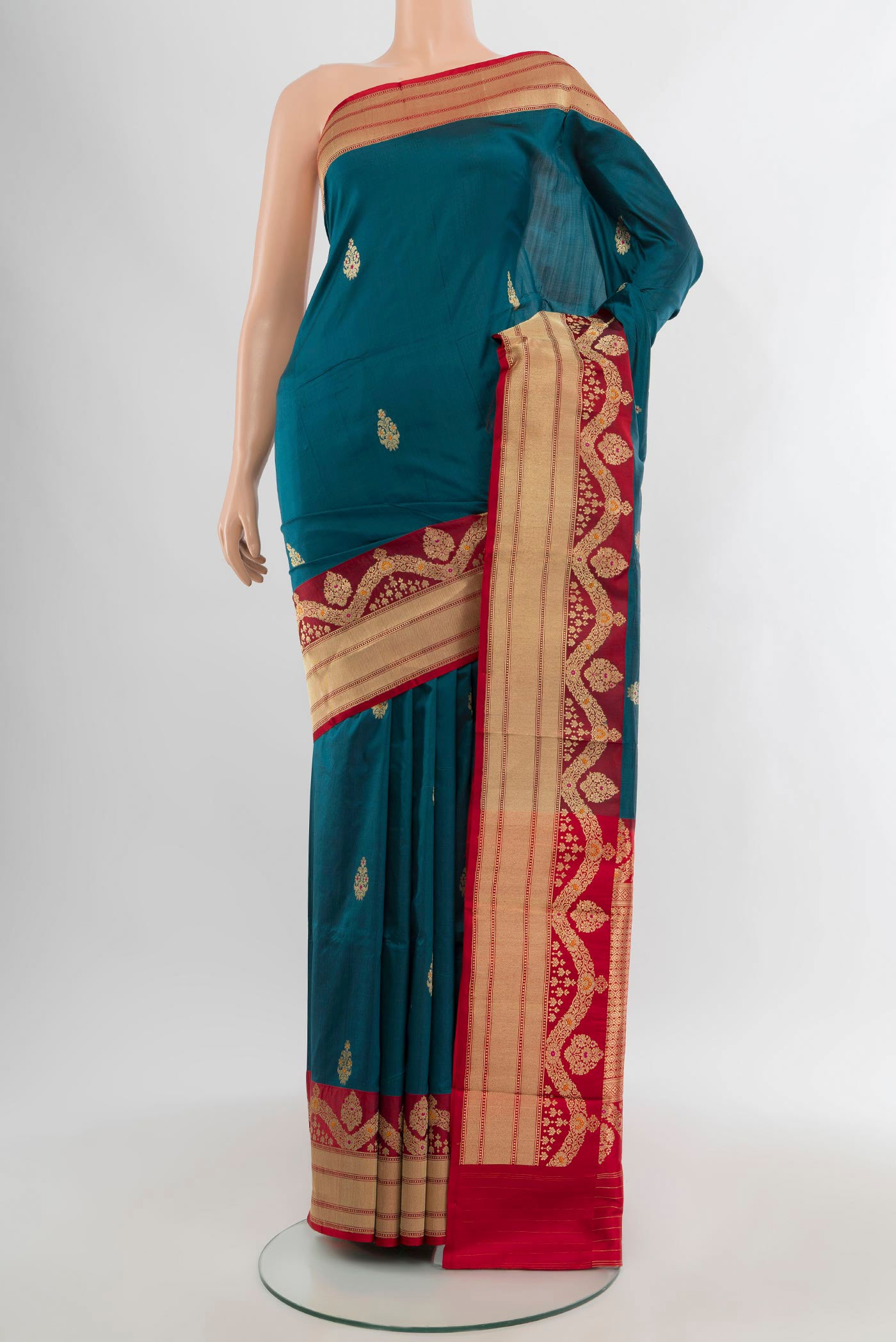 Blue Banarasi Katan Silk Saree with Zari Butta on the body and Zari Border.  displayed on a mannequin