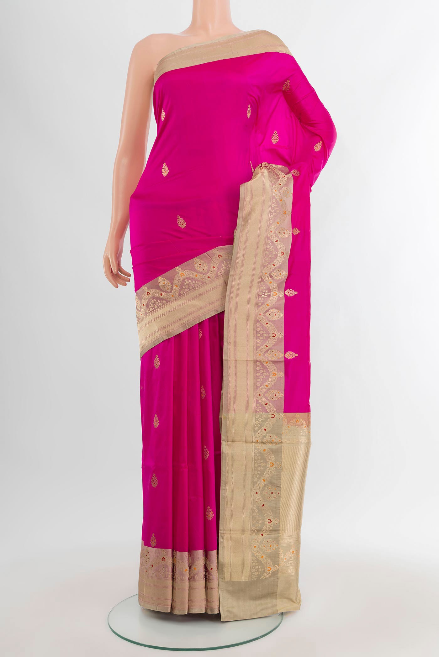 Rani Pink Banarasi Katan Silk Saree with Zari Butta on the body and Zari Border.  displayed on a mannequin