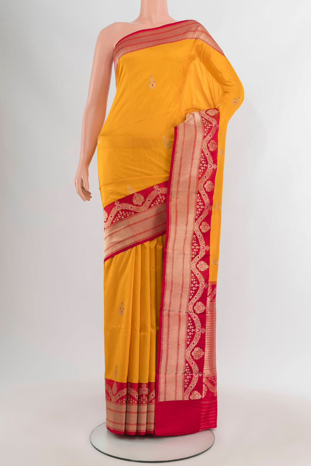 Yellow Banarasi Katan Silk Saree with Zari Butta on the body and Zari Border.  displayed on a mannequin