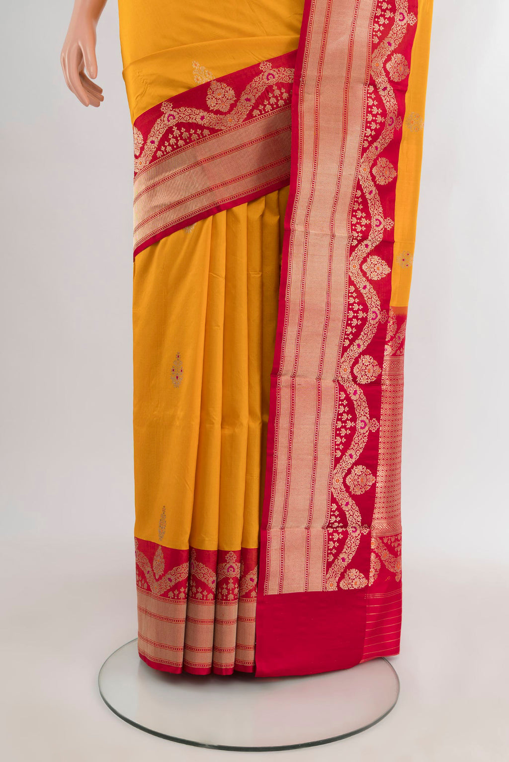 Pleats and pallu of Yellow Banarasi Katan Silk Saree with Zari Butta on the body and Zari Border. 