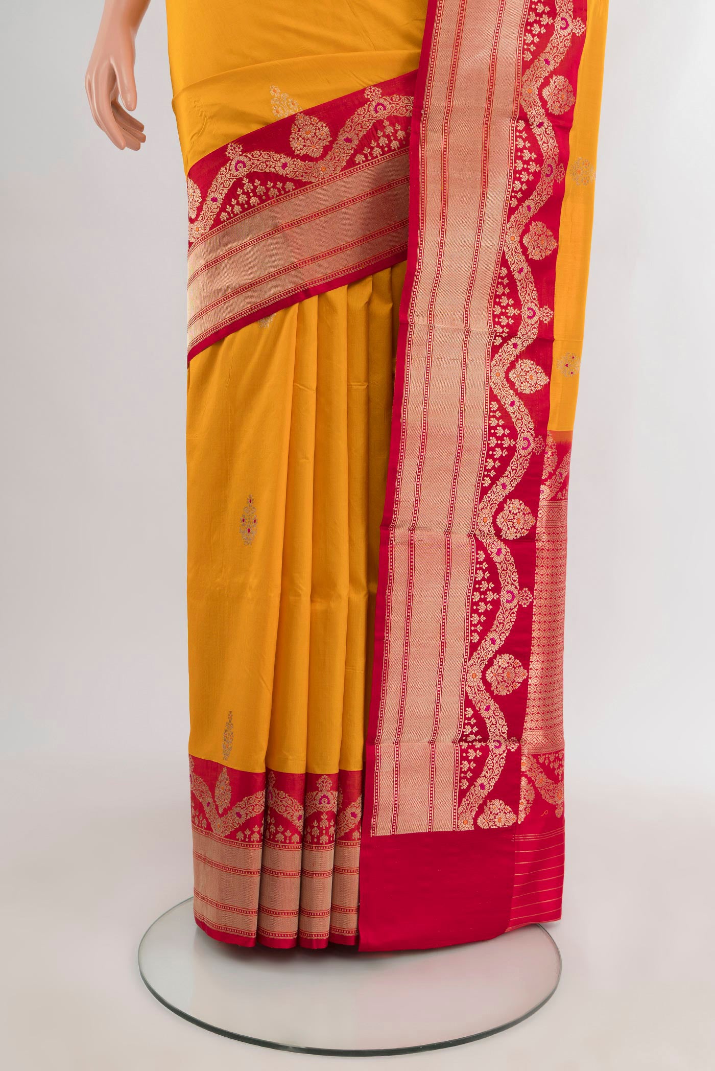 Pleats and pallu of Yellow Banarasi Katan Silk Saree with Zari Butta on the body and Zari Border. 