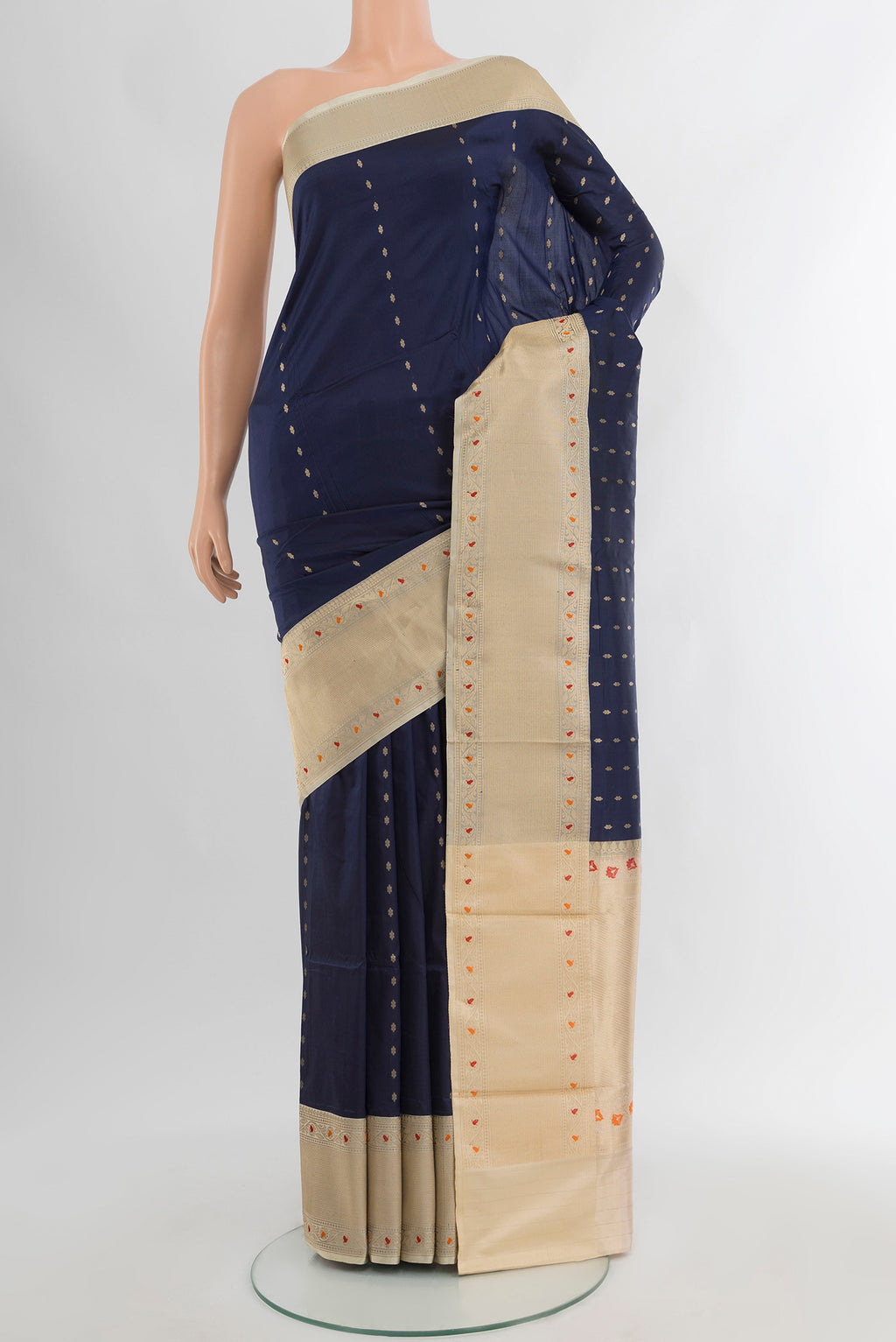 Navy Blue Banarasi Katan Silk Saree with Zari Butta on the body and Zari Border.  displayed on a mannequin