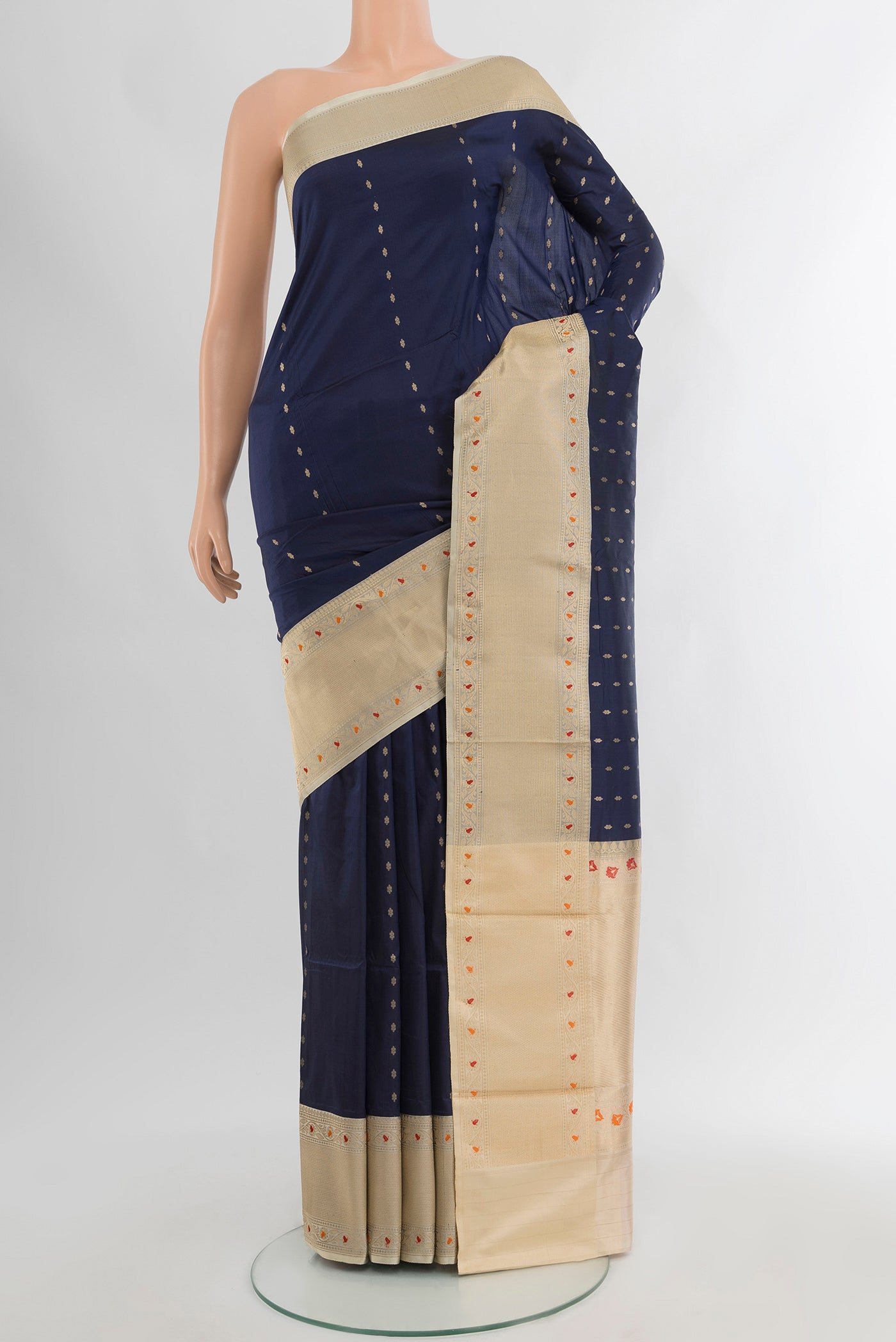 Navy Blue Banarasi Katan Silk Saree with Zari Butta on the body and Zari Border.  displayed on a mannequin