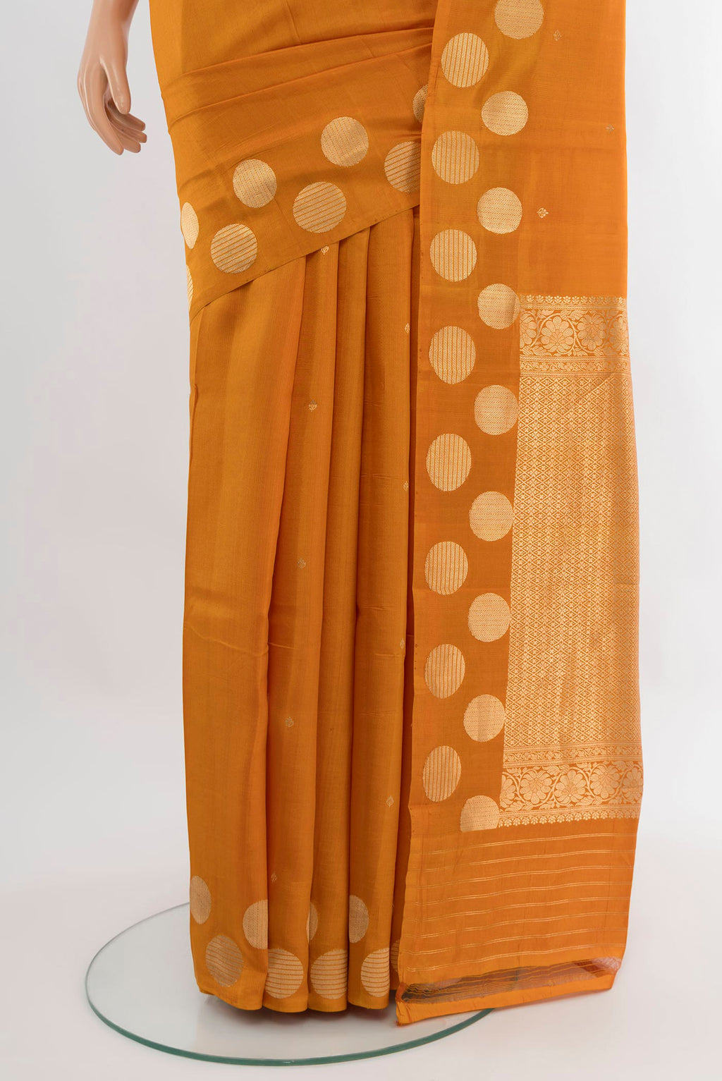 Pleats and pallu of Mustard Banarasi Katan Silk Saree with Zari Butta on the body and Without Border. 