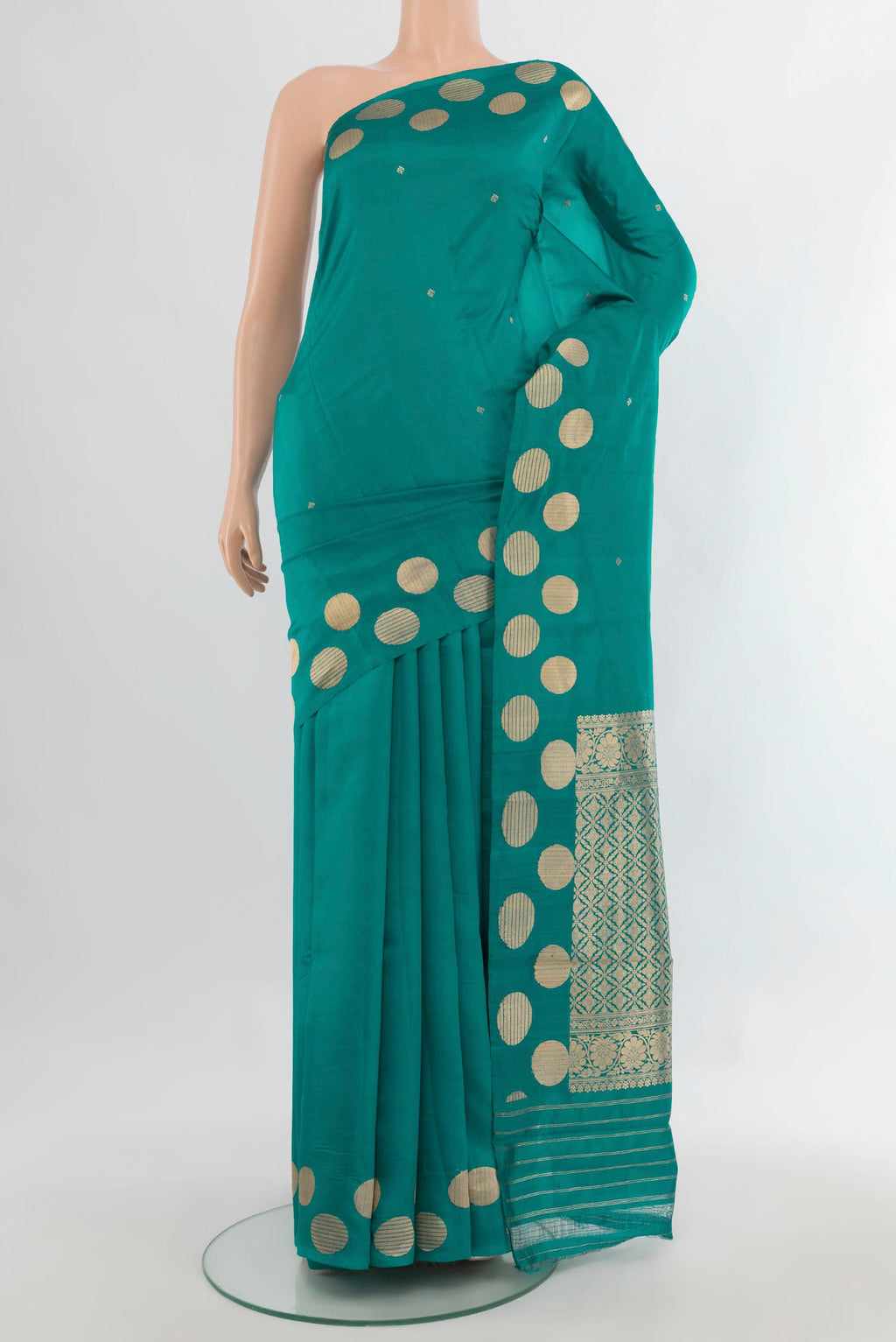 Pure Silk Teal Banarasi Katan Saree with Zari Butta on the body and Fancy Border.  displayed on a mannequin