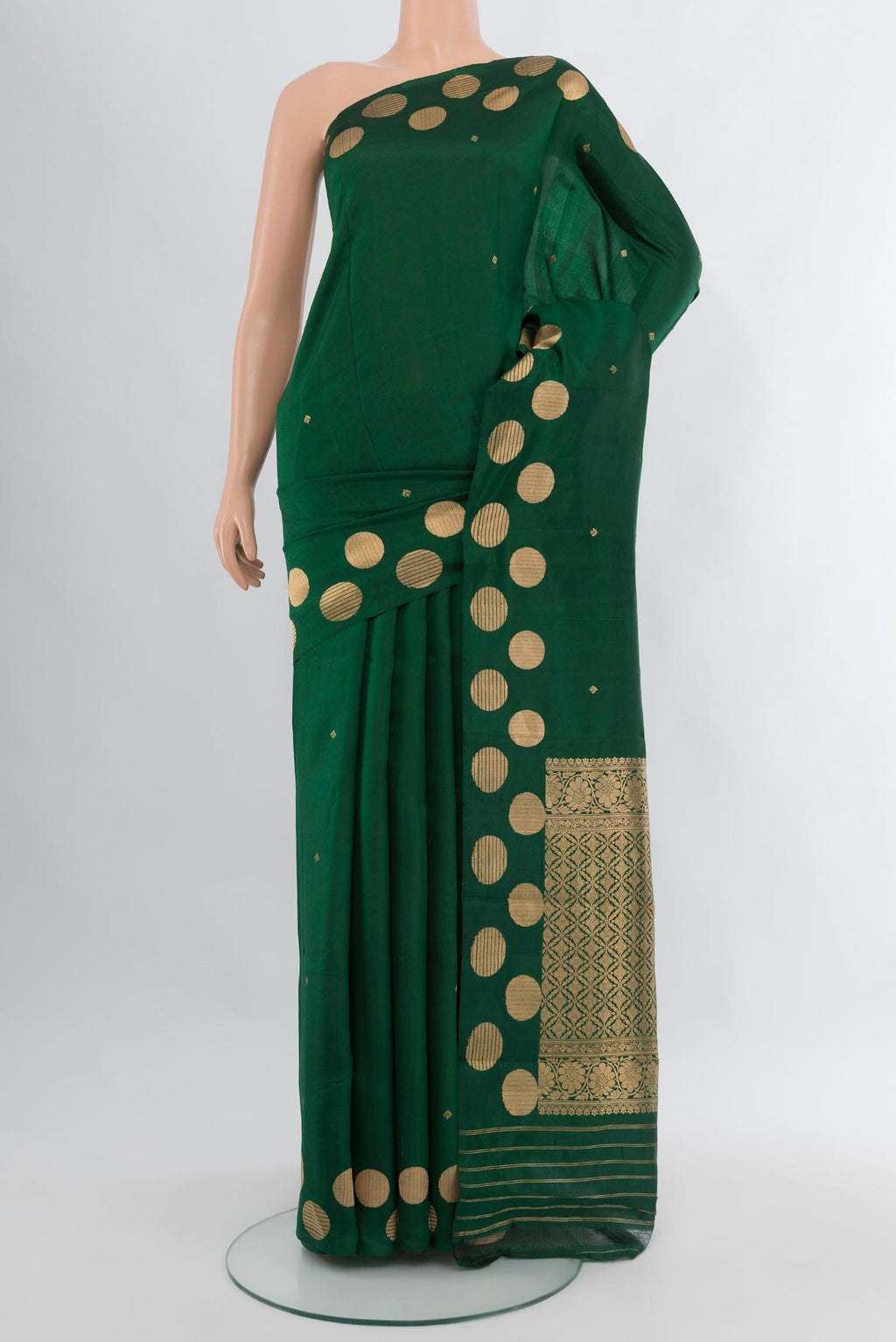 Bottle Green Banarasi Katan Silk Saree with Zari Butta on the body and Fancy Border.  displayed on a mannequin