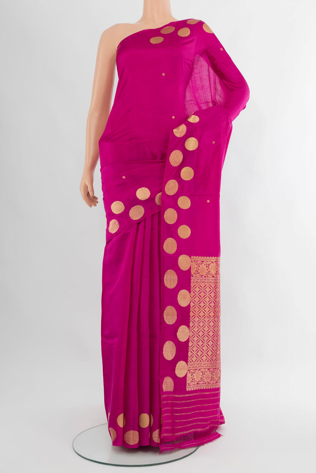 Magenta Banarasi Katan Silk Saree with Zari Butta on the body and Without Border.  displayed on a mannequin