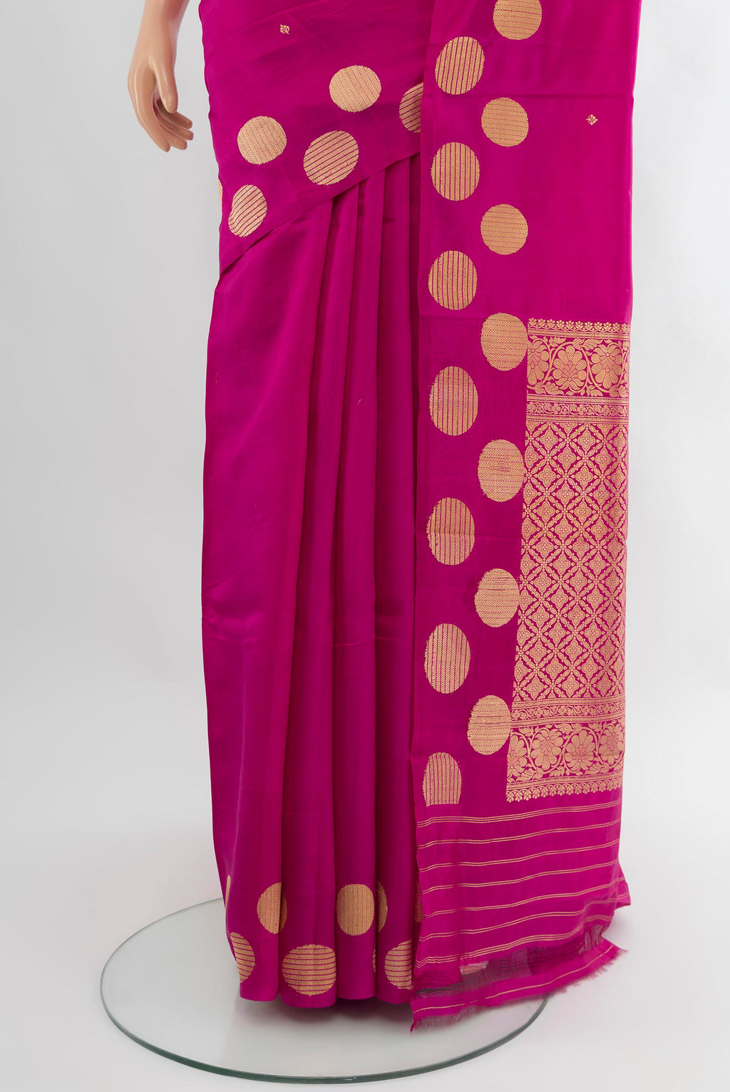 Pleats and pallu of Magenta Banarasi Katan Silk Saree with Zari Butta on the body and Without Border. 