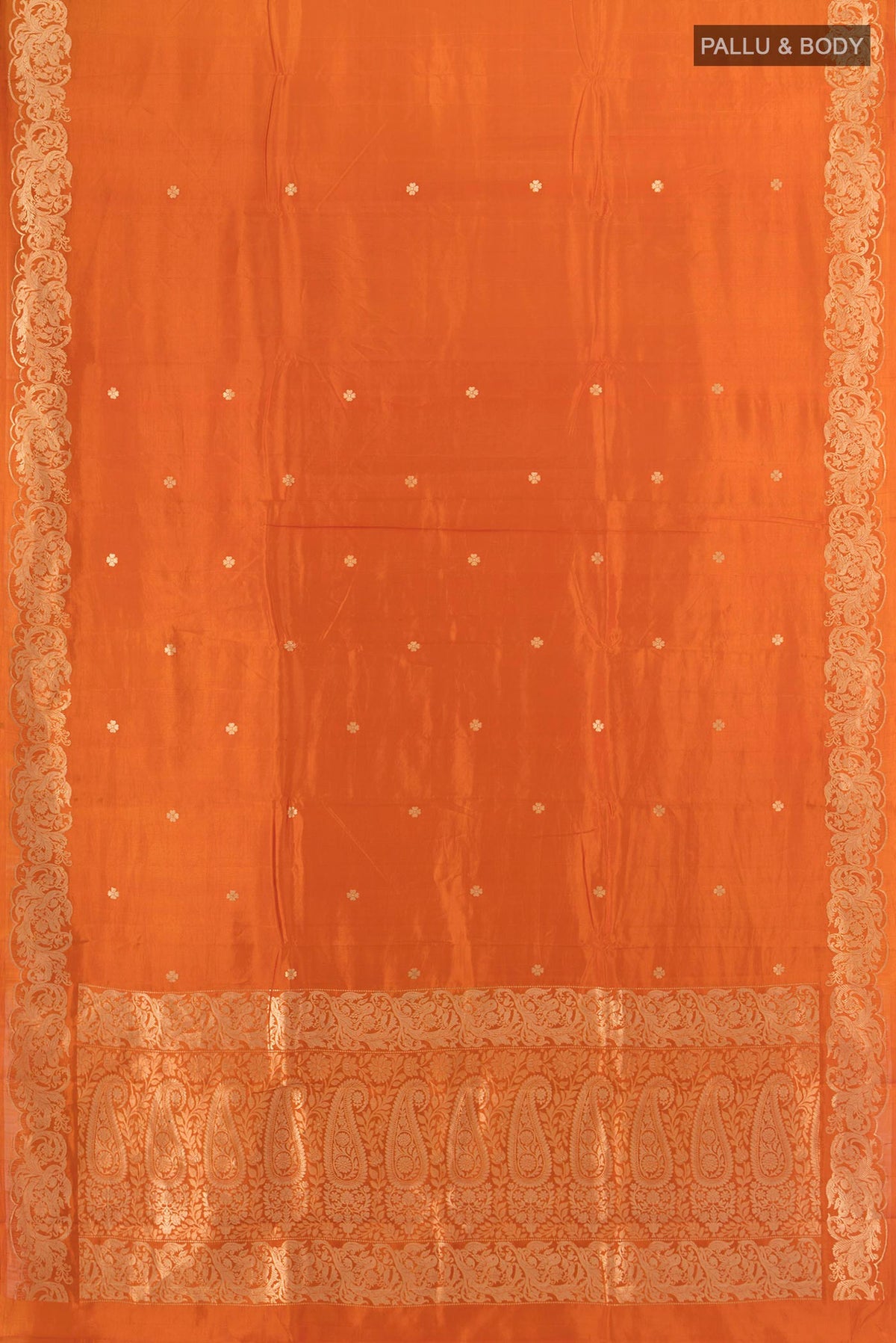 Flat view of Pure Silk Brick Orange Banarasi Katan Saree with Zari Butta on the body and Zari Border. 