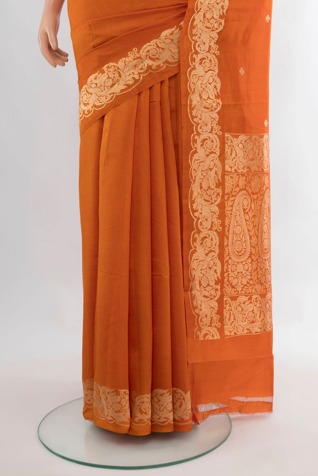 Pleats and pallu of Pure Silk Brick Orange Banarasi Katan Saree with Zari Butta on the body and Zari Border. 