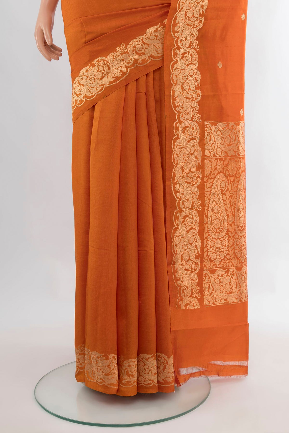 Pleats and pallu of Pure Silk Brick Orange Banarasi Katan Saree with Zari Butta on the body and Zari Border. 
