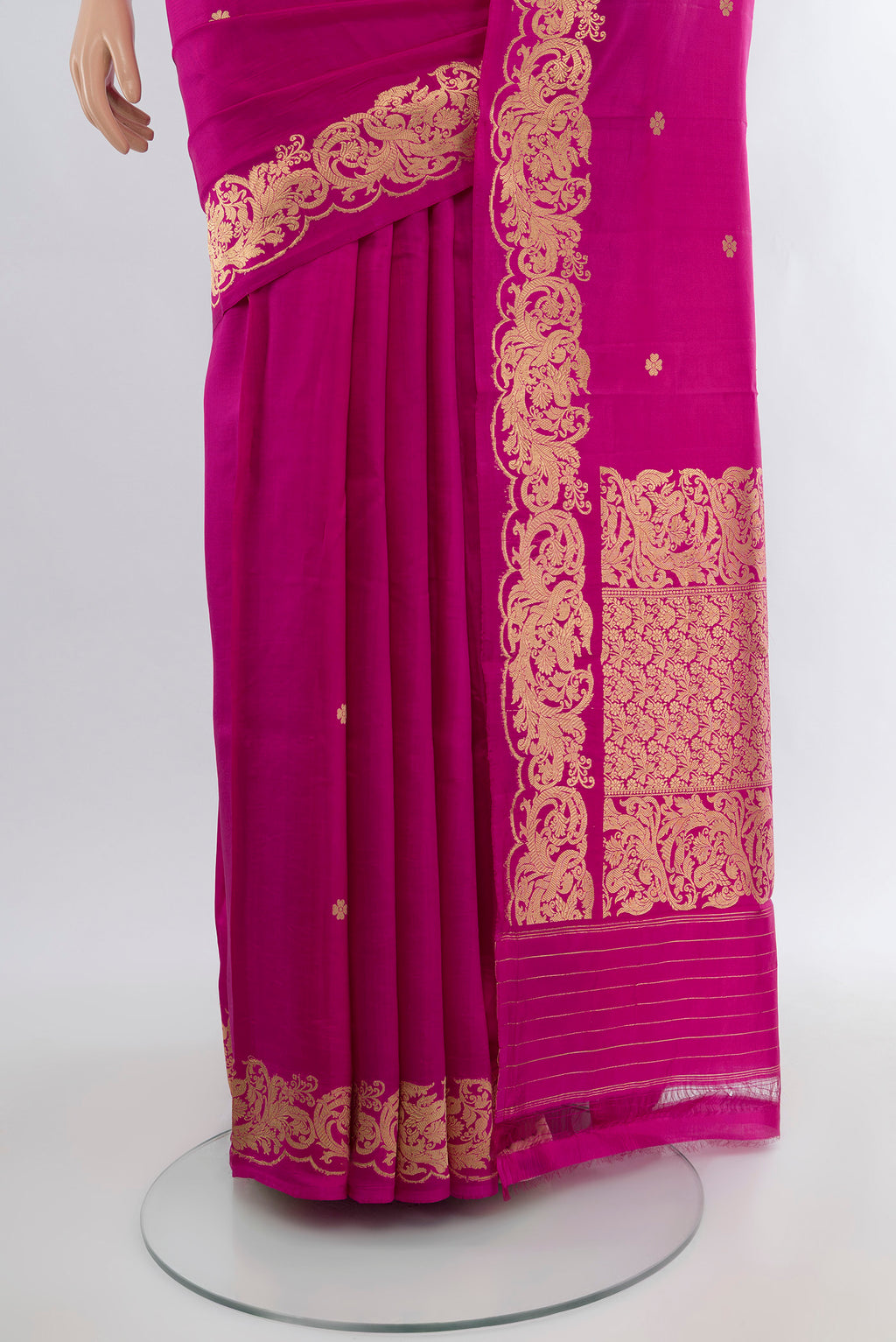 Pleats and pallu of Magenta Banarasi Katan Silk Saree with Zari Butta on the body and Zari Border. 
