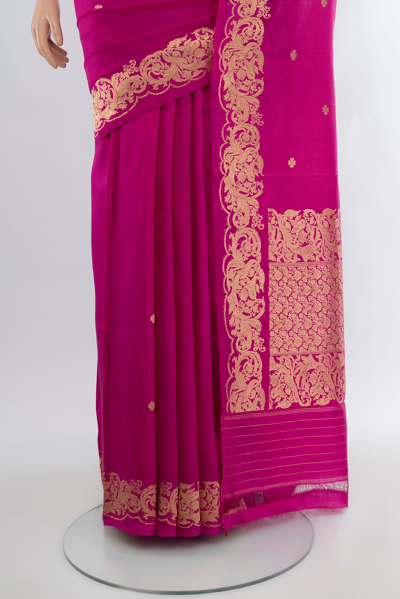 Pleats and pallu of Magenta Banarasi Katan Silk Saree with Zari Butta on the body and Zari Border. 