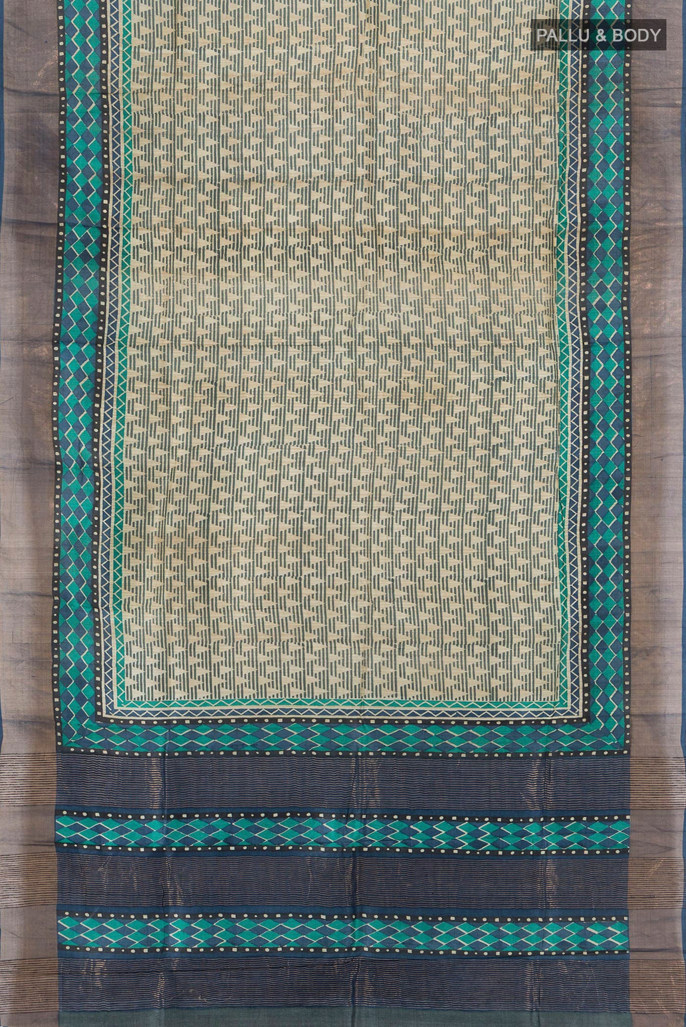 Flat view of Beige Tussar Silk Saree with Geometric Print on the body and Zari Border. 