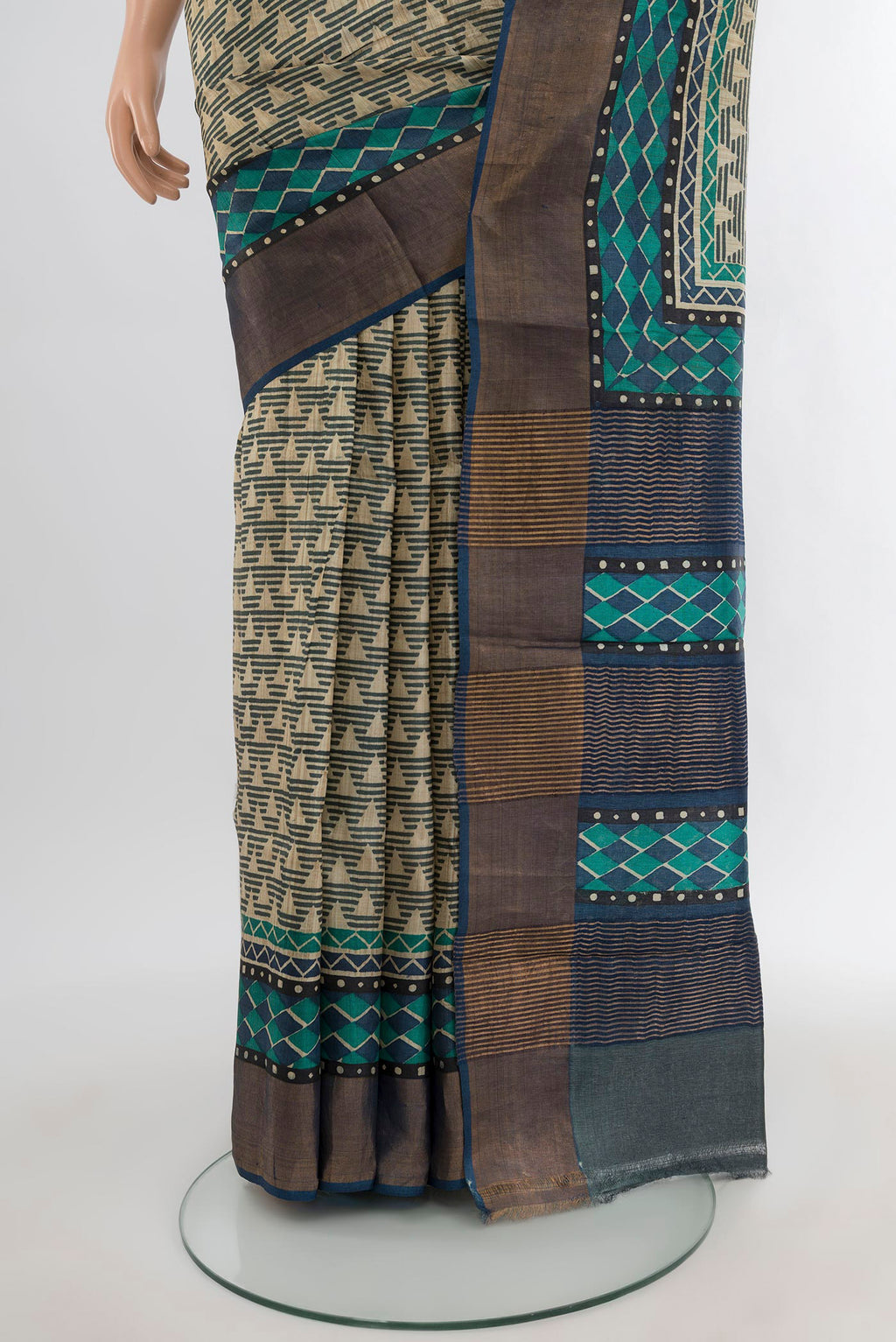Pleats and pallu of Beige Tussar Silk Saree with Geometric Print on the body and Zari Border. 