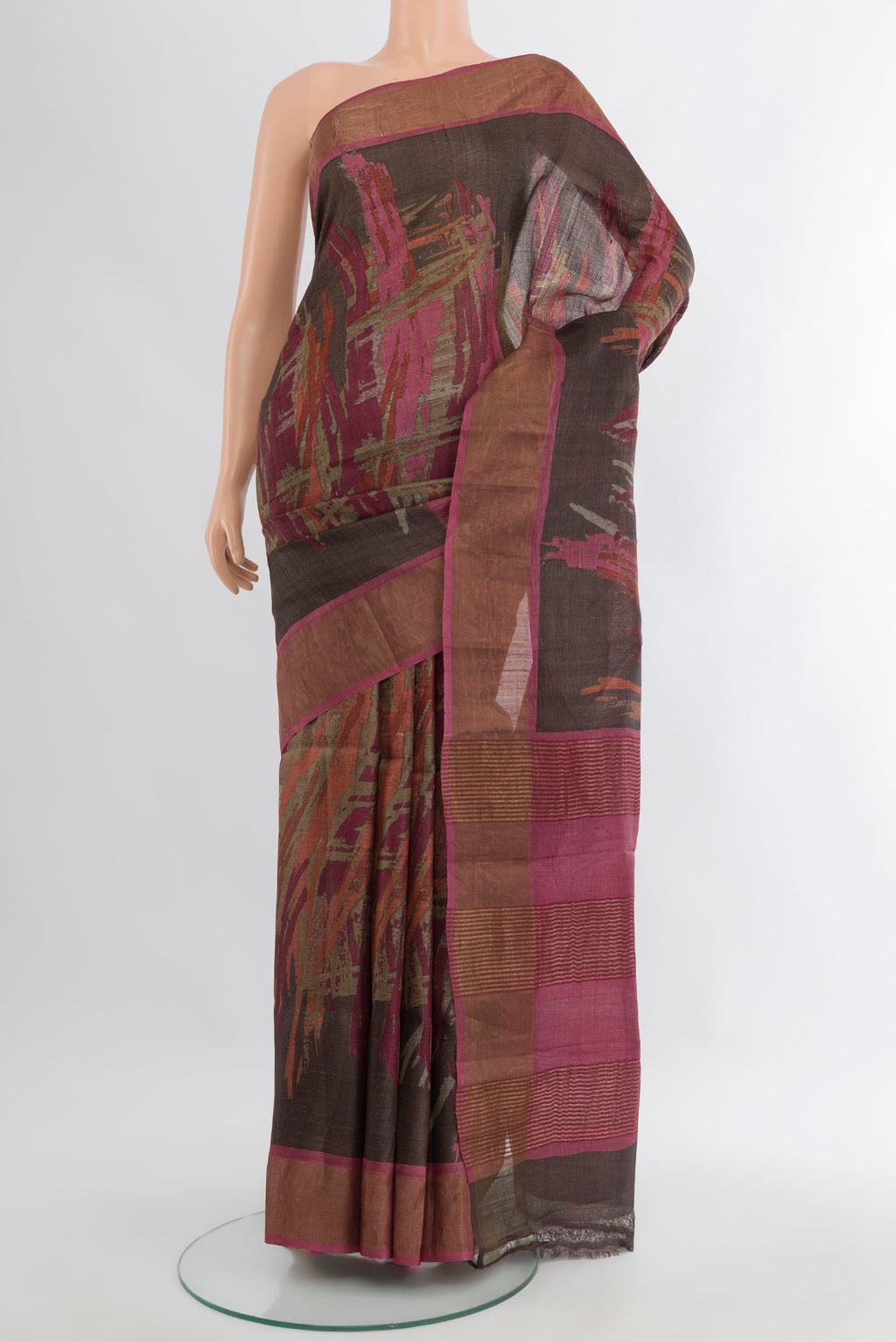 Brown Tussar Silk Saree with Floral Print on the body and Zari Border.  displayed on a mannequin