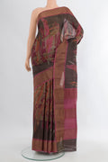 Brown Tussar Silk Saree with Floral Print on the body and Zari Border.  displayed on a mannequin